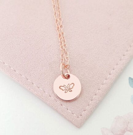 rose gold pendant with butterfly symbol