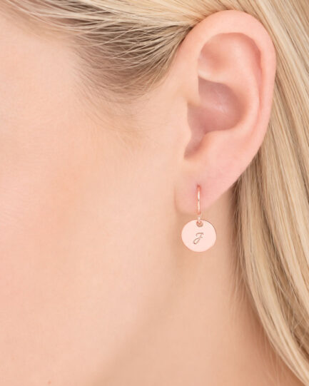 woman wearing rose gold custom earrings